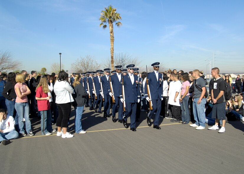 The United States Air Force Honor Guard Drill Team performs for students of Basic High School, Las Vegas, Nev., March 8, 2007. The Drill Team is the traveling component of the Air Force Honor Guard and tours Air Force bases world wide showcasing the precision of today's Air Force to recruit, retain, and inspire Airmen for the Air Force mission. (U.S. Air Force photo by Airman 1st Class Rusti Caraker)(Released)