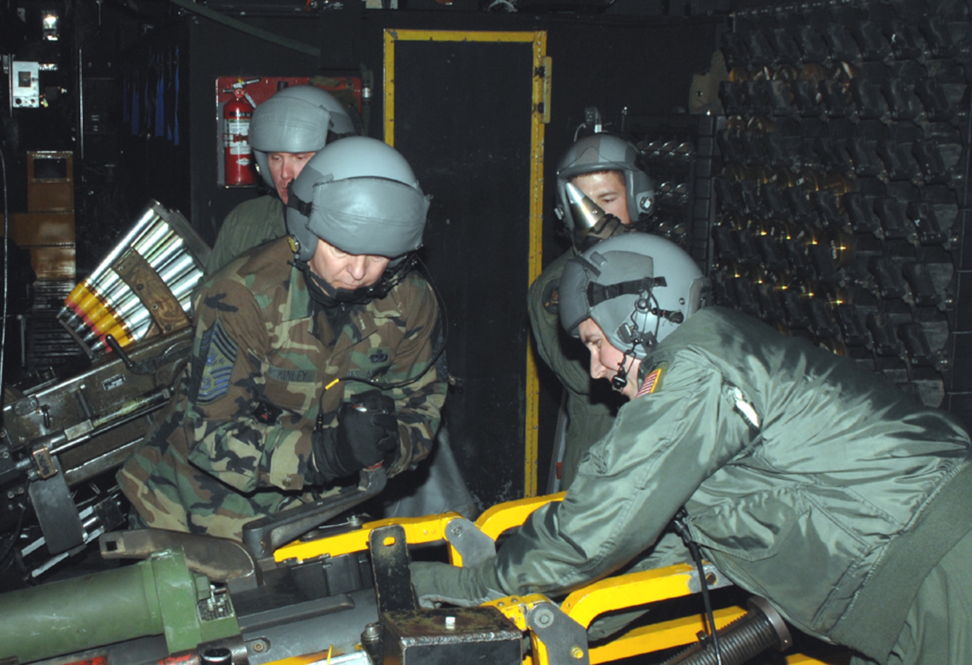 Chief Master Sgt. of the Air Force Rodney J. McKinley joins a 16th Special Operations Squadron gunner, Master Sgt. Preface Hedin, with loading the 105mm howitzer on the AC-130H Spectre gunship March 5, while Senior Airman Mathew Busman works the 40mm Bofors cannon and Staff Sgt. James Mobley oversees the process. (U.S. Air Force photo/Senior Airman Andy M. Kin) 