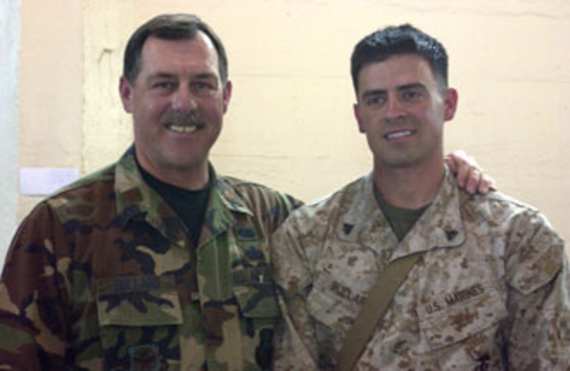 Maj. Bullard and son Cpl. Bullard re-connect after a lengthy deployment.   The two were reunited at March Air Reserve Base.  (U.S. Air Force photo by Staff Sgt. Amy Abbott)