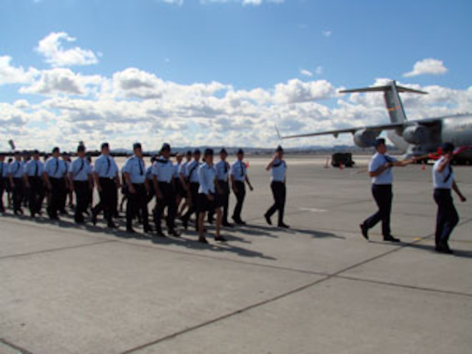 Some 400 Air Force Junior ROTC cadets recently performed a Pass in Review ceremony at March Air Reserve Base. The Pass in Review is a long-standing military tradition that began as a way for a newly assigned commander to inspect their troops. Brig. Gen. James L. Melin, commander, 452nd Air Mobility Wing, served as the reviewing officer. Cadets from several schools in the area participated in the ceremony. A KC-135 and a C-17 were opened for the cadets to tour. Afterwards, the students were treated to pizza and soda served by local community members. (U.S. Air Force photos by Maj. Don Traud)