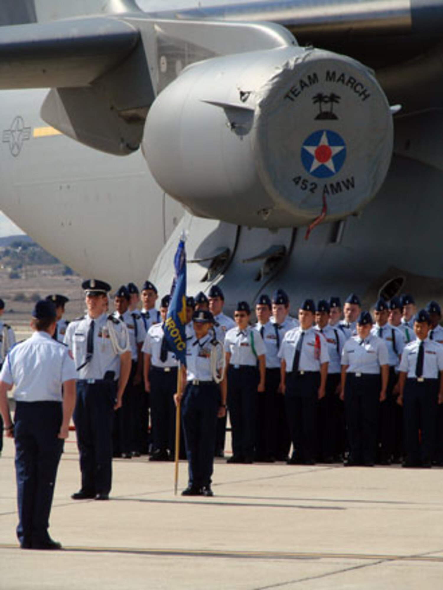 Some 400 Air Force Junior ROTC cadets recently performed a Pass in Review ceremony at March Air Reserve Base. The Pass in Review is a long-standing military tradition that began as a way for a newly assigned commander to inspect their troops. Brig. Gen. James L. Melin, commander, 452nd Air Mobility Wing, served as the reviewing officer. Cadets from several schools in the area participated in the ceremony. Afterwards, the students were treated to pizza and soda served by local community members. (U.S. Air Force photos by Maj. Don Traud)