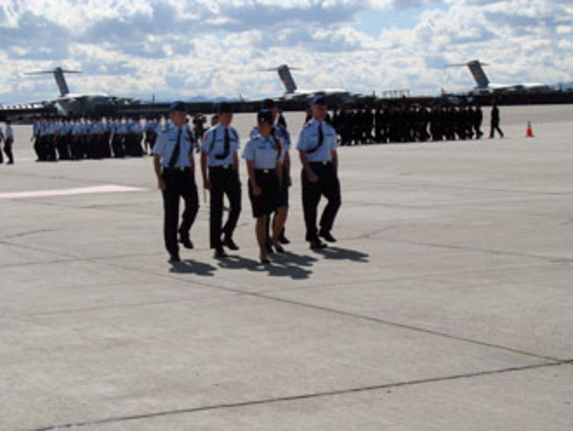 Some 400 Air Force Junior ROTC cadets recently performed a Pass in Review ceremony at March Air Reserve Base. The Pass in Review is a long-standing military tradition that began as a way for a newly assigned commander to inspect their troops. Brig. Gen. James L. Melin, commander, 452nd Air Mobility Wing, served as the reviewing officer. Cadets from several schools in the area participated in the ceremony. Afterwards, the students were treated to pizza and soda served by local community members. (U.S. Air Force photos by Maj. Don Traud)