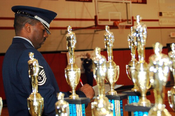 WRIGHT-PATTERSON AFB, Ohio – Air Force reservist Master Sgt. Mark Lyle,Superintendent of the 445th Airlift Wing Honor Guard, is surrounded by trophies.  Sergeant Lyle was a judge at the Junior Reserve Officers’ Training Corps (JrROTC) "All Air Force Regional Drill Meet" that was held at Tecumseh High School, New Carlisle, Ohio. (U.S. Air Force photo/Tech. Sgt. Charlie Miller)