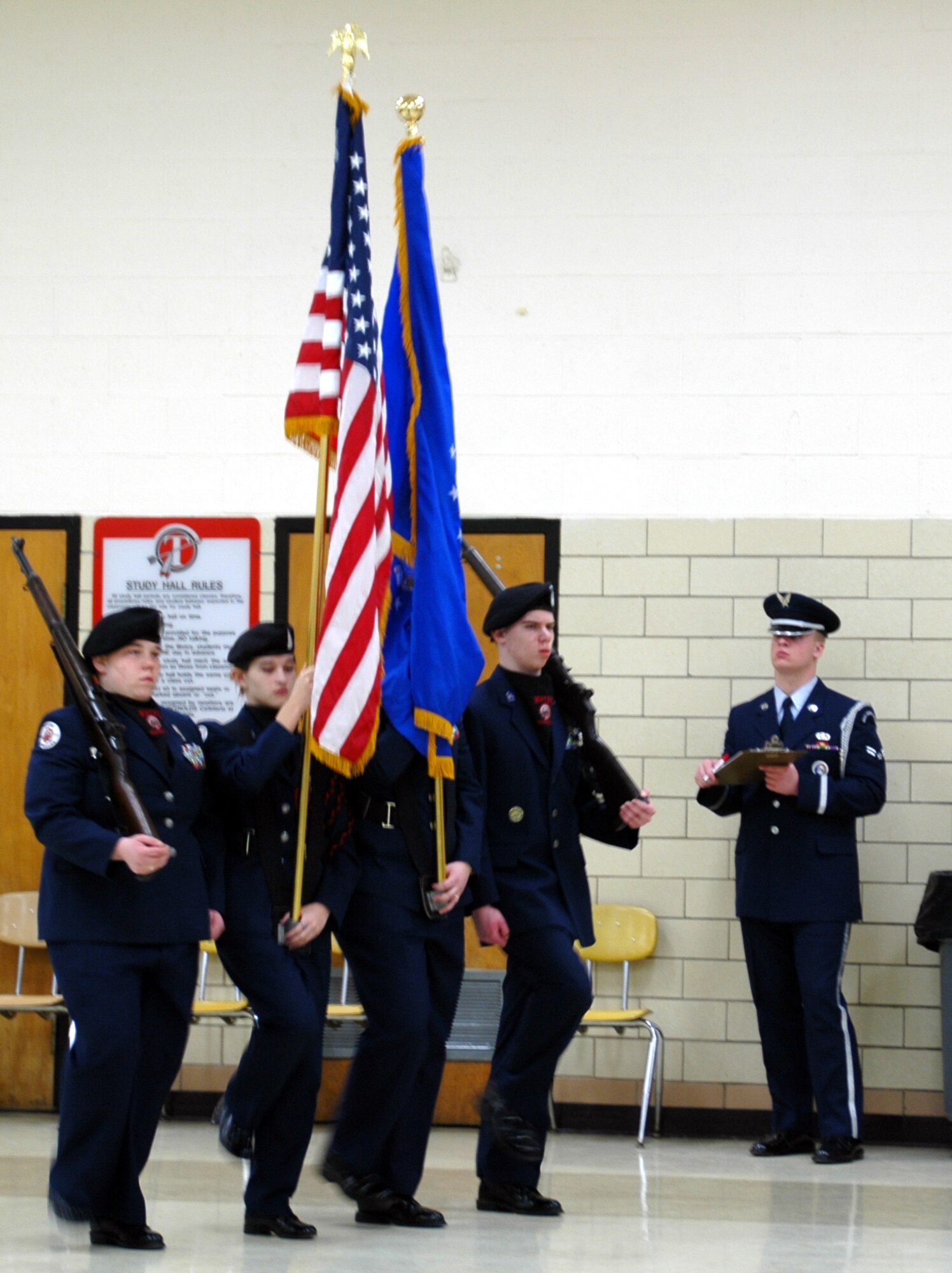 WRIGHT-PATTERSON AFB, Ohio -- Airman First Class Erik W. Riehle from the Wright Patterson Air Force Base Honor Guard inspects  Junior Reserve Officers’ Training Corps (JrROTC) drill team at the "All Air Force Regional Drill Meet" that was held at Tecumseh High School, New Carlisle, Ohio. (U.S. Air Force Photo/Tech. Sgt. Charlie Miller). 