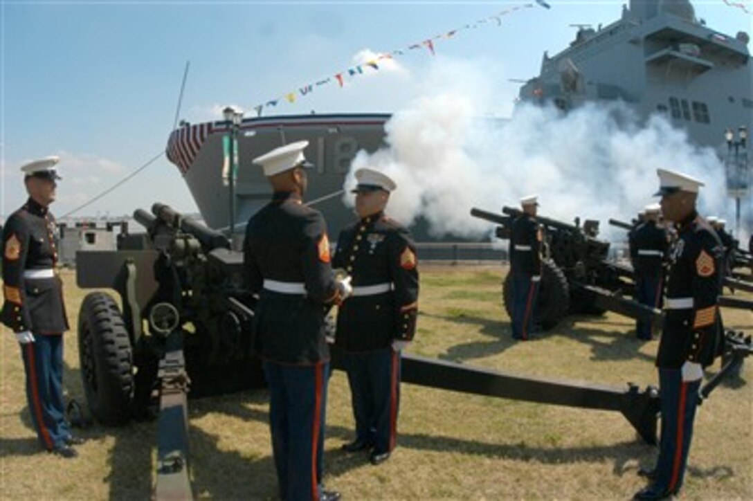 Marines from 14th Marine Artillery Detachment fire a 19-gun salute in honor of U.S. Sen. David Vitter during arrival honors for the commissioning of the amphibious transport dock ship USS New Orleans in New Orleans, March 10, 2007.