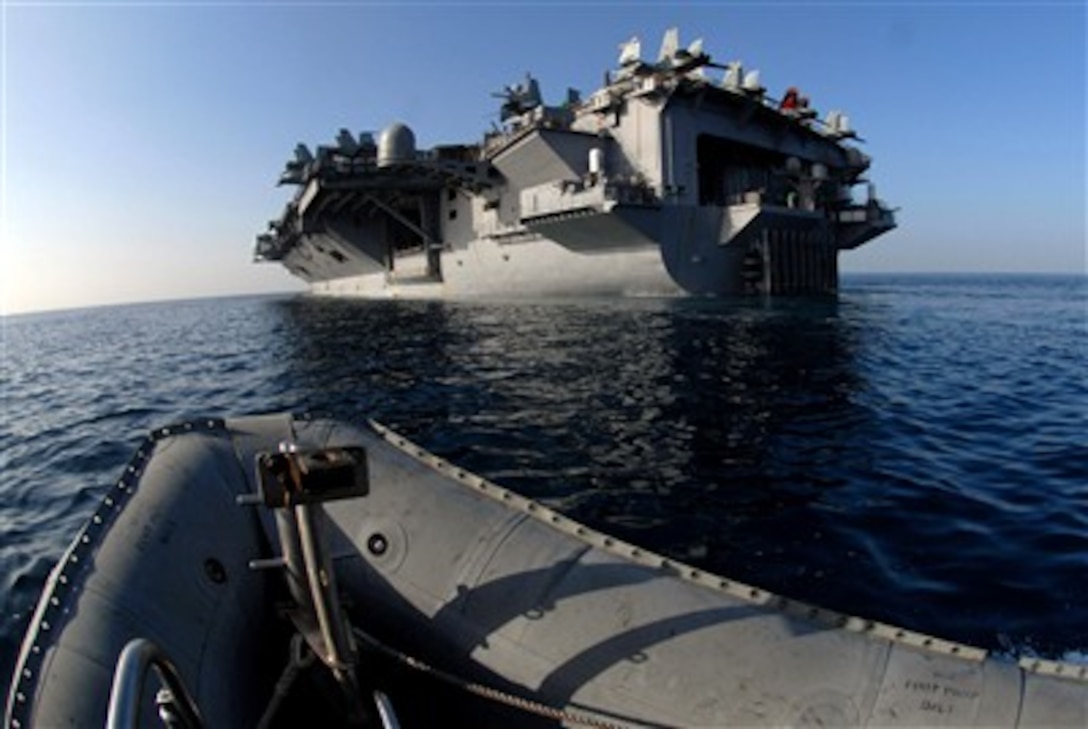 Boatswain's mates assigned to deck department steer a rigid hull inflatable boat toward the back end of Nimitz-class aircraft carrier USS John C. Stennis  during a training exercise for security operations and man overboard scenarios in the Arabian Sea, March 6, 2007.