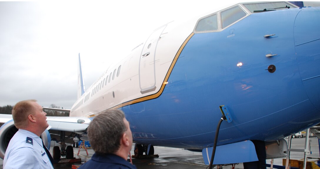 Maintenance Group commander Lt. Col. Kirk Peddicord and Chief Master Sgt. George Elder watch the final preparations and countdown to the takeoff of the 932nd Airlift Wing's first C-40C.  The 932nd Airlift Wing flies both C-9C and C-40C planes.