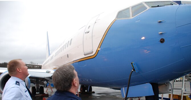 Maintenance Group commander Lt. Col. Kirk Peddicord and Chief Master Sgt. George Elder watch the final preparations and countdown to the takeoff of the 932nd Airlift Wing's first C-40C.  The 932nd Airlift Wing flies both C-9C and C-40C planes.