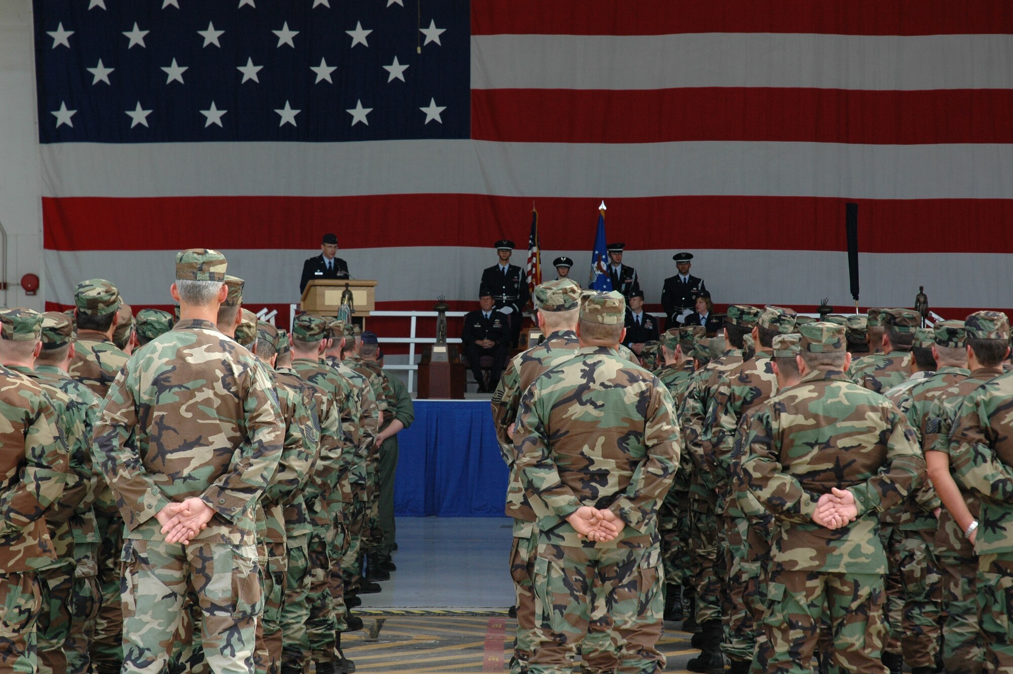 Members of the 944th Maintenance Group and the 302nd Fighter Squadron stand in formation at ceremony honoring the men and women who have served in those units over the last 20 years at Luke Air Force Base, Ariz. The 944th Fighter Wing's 17 F-16 Fighting Falcons were reassigned as part of Base Realignment and Closure directives and the unit will lose 485 related positions on March 31, 2007. (U.S. Air Force photo/Staff Sgt. Susan Stout)
