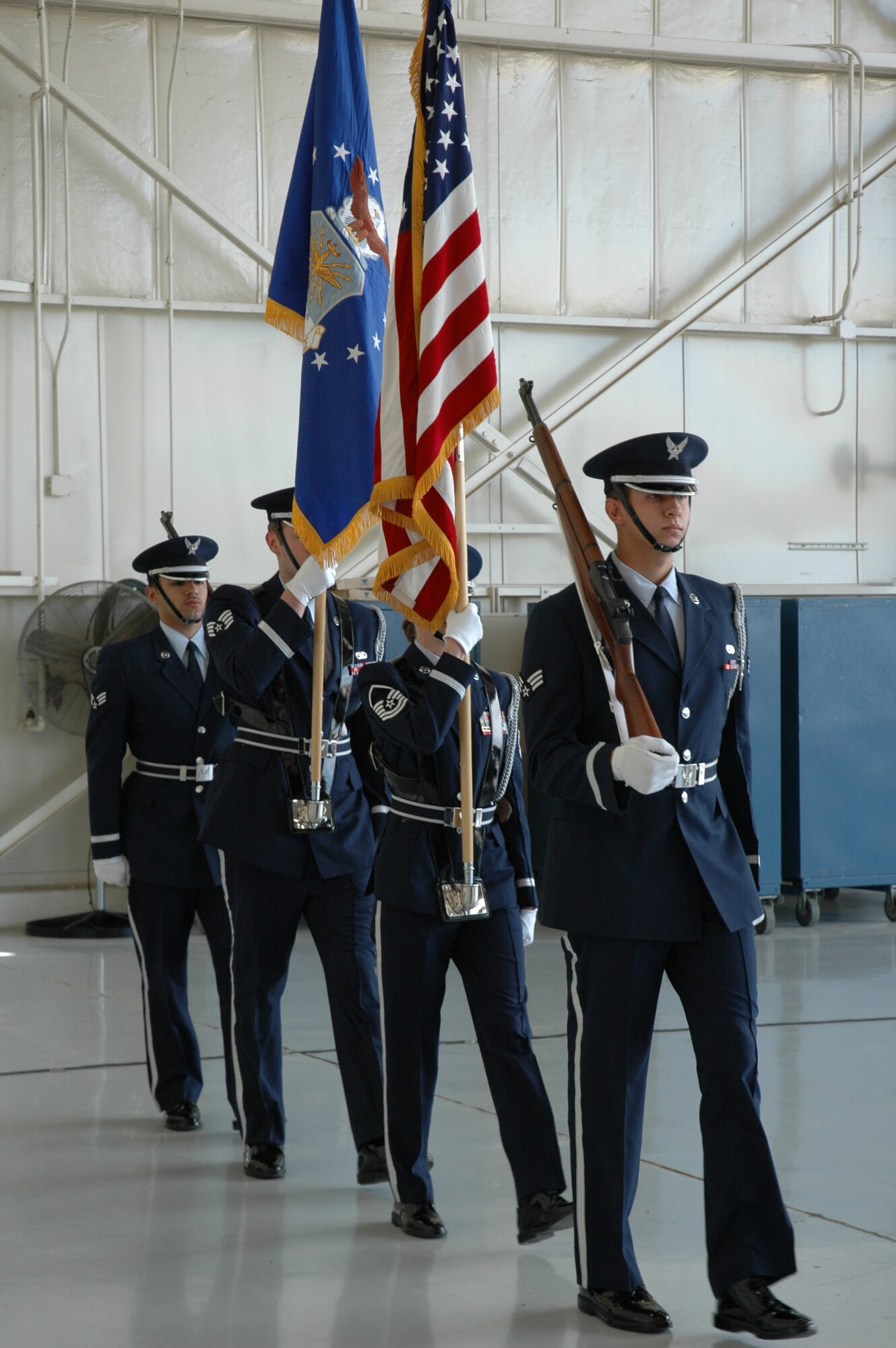 The 944th Fighter Wing Honor Guard marches to the stage at the 944th Maintenance Group deactivation and 302nd Fighter Squadron transfer ceremonies on March 10, 2007, at Luke Air Force Base, Ariz. (U.S. Air Force photo/Staff Sgt. Susan Stout)