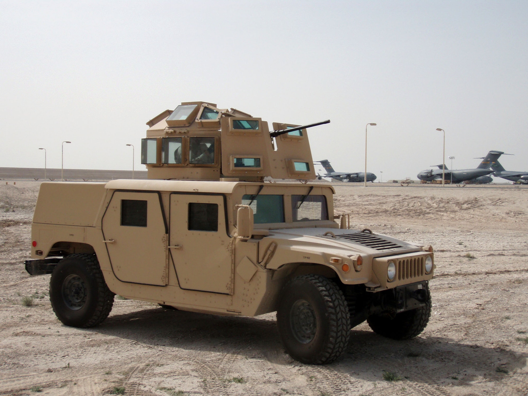 In less than 80 days, the improved protective turret prototype on this Humvee was taken from sketched concept to hard-core assembly. The igloo-shaped structure is designed to wrap around and over the turret gunner, thereby minimizing the sniper threat. The protective prototype's development and testing stemmed from the death of Airman 1st Class Leebernard Chavis, who was killed by sniper fire in October 2006. (U.S. Air Force photo)