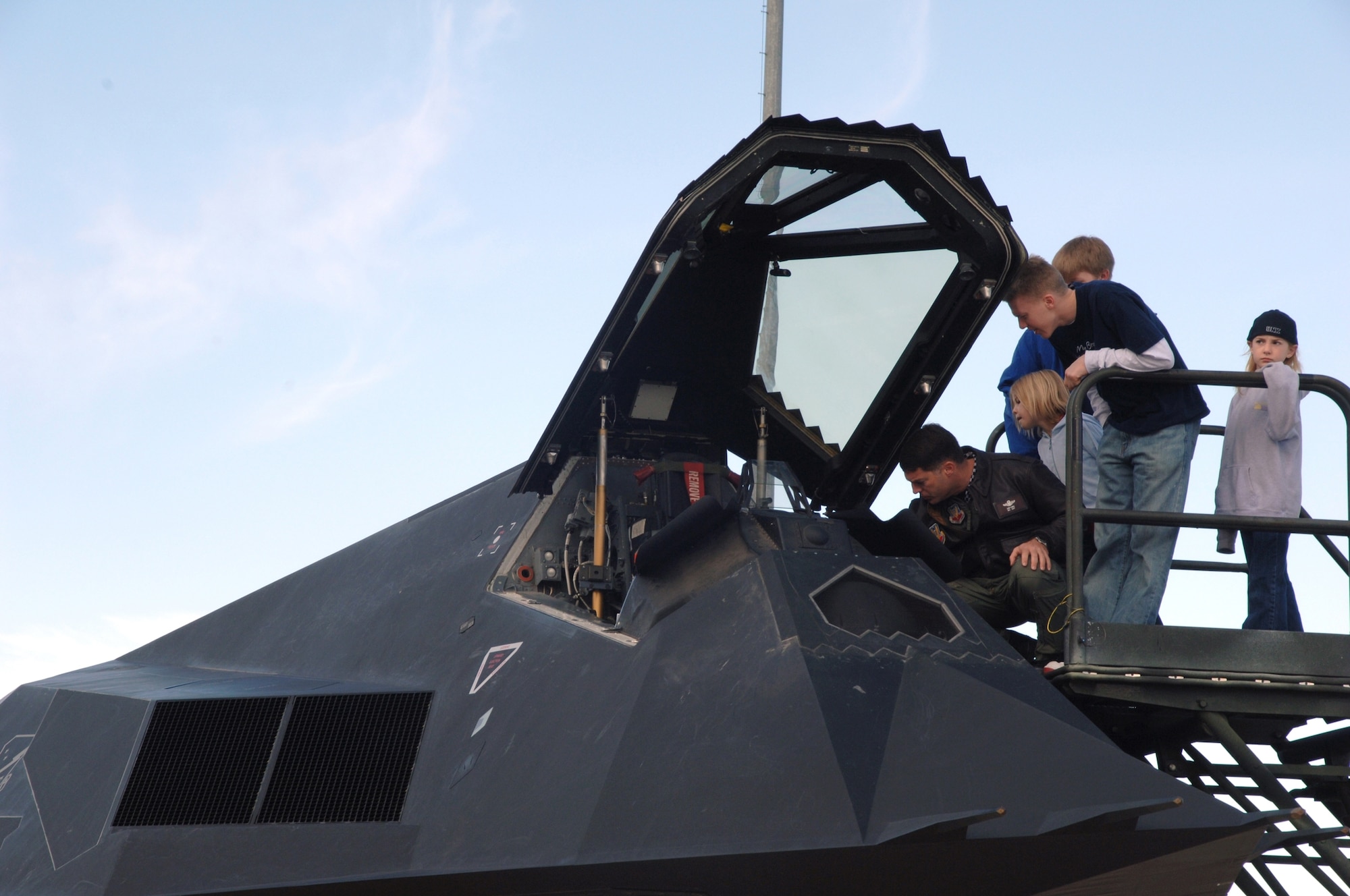 Families were able to look in the cockpit of the F-117A Nighthawk before six were retired to Tonopah Test Range, Nev., March 12 (U.S. Air Force photo by Airman !st Class Tiffany Mayo)