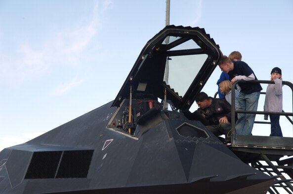 Families were able to look in the cockpit of the F-117A Nighthawk before six were retired to Tonopah Test Range, Nev., March 12 (U.S. Air Force photo by Airman 1st Class Tiffany Mayo) 
