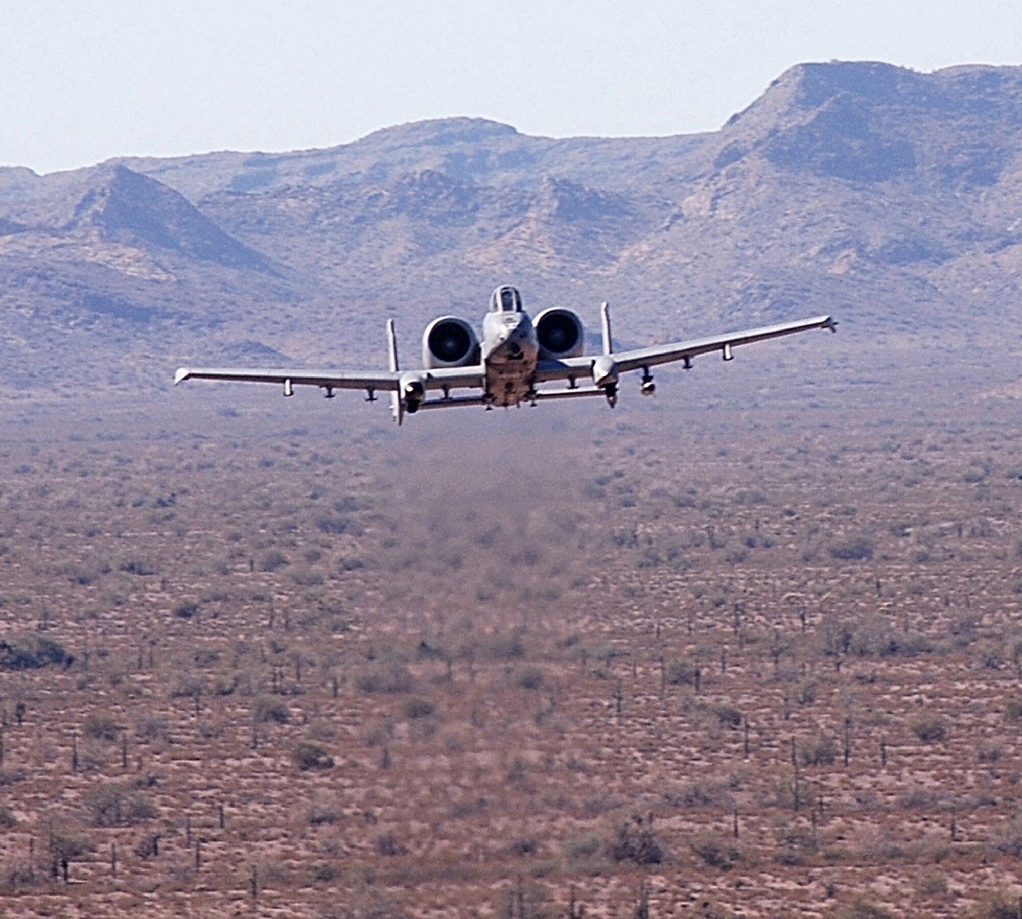 An Air Force Reserve Command A-10 Thunderbolt II from the 303rd Fighter Squadron, part of the 442nd Fighter Wing at Whiteman Air Force Base, Mo., flies low over the Barry M. Goldwater Range, Ariz., after dropping its payload during a  training exercise Feb. 26, 2007.
Based from Davis-Monthan Air Force Base, Ariz., the reservists used the range's more than 2,700 square miles to practice tactics and drop live ordance. (U.S. Air Force photo/Staff Sgt. Tom Talbert) 