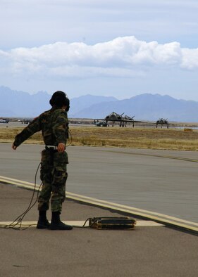 The first three of six F-117A Nighthawks taxi the runway before taking off to Tonopah Test Range, Nev., March 12. (U.S. Air Force photo by Airman Jamal Sutter)