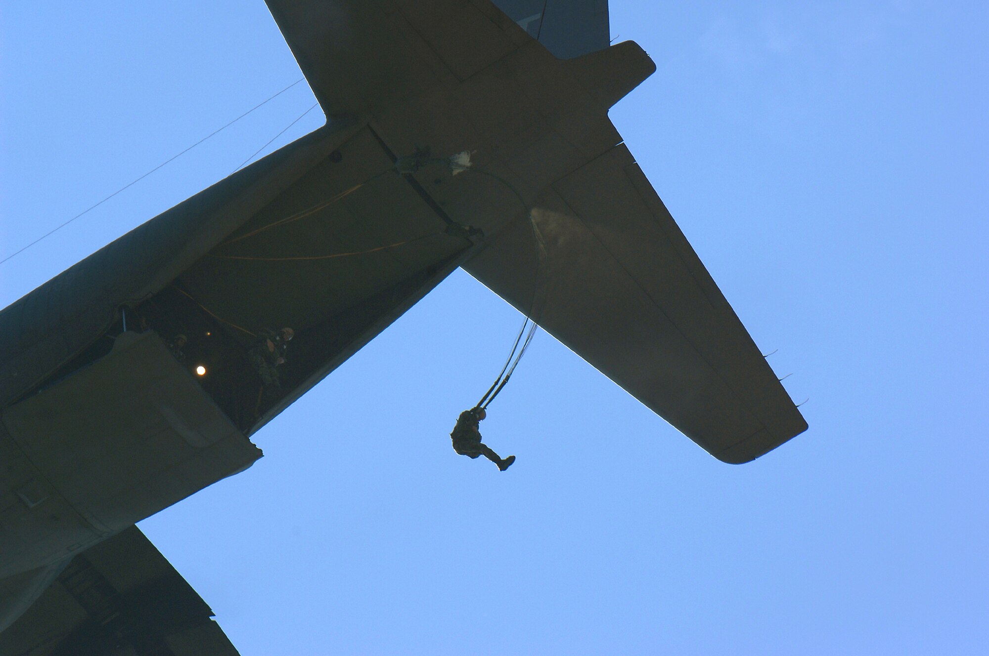 MOODY AIR FORCE BASE, Ga. --  A parachutist jumps from a Moody HC-130P during a static line jump here March 9. Jumpers are required to jump at least four times a year to maintain their qualifications.  (U.S. Air Force photo by Airman 1st Class Gina Chiaveratti)
