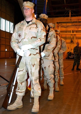 Honor Guard members wait in preparation for the posting of the colors in the Thunderdome at Eielson Air Force Base, Alaska March 9 during the 354th Fighter Wing Welcome Home Ceremony. The ceremony honored more than 400 Airmen who returned from deployments over the past six months. (U.S. Air Force photo/Airman 1st Class Jonathan Snyder)