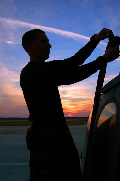 MOODY AIR FORCE BASE, Ga. (ACCNS) -- Airman 1st Class Wayne Premo, 723rd Aircraft Maintenance Squadron HH-60G Pave Hawk crew chief, prepares his helicopter for flight March 12. (U.S. Air Force photo by Tech. Sgt. Parker Gyokeres) 