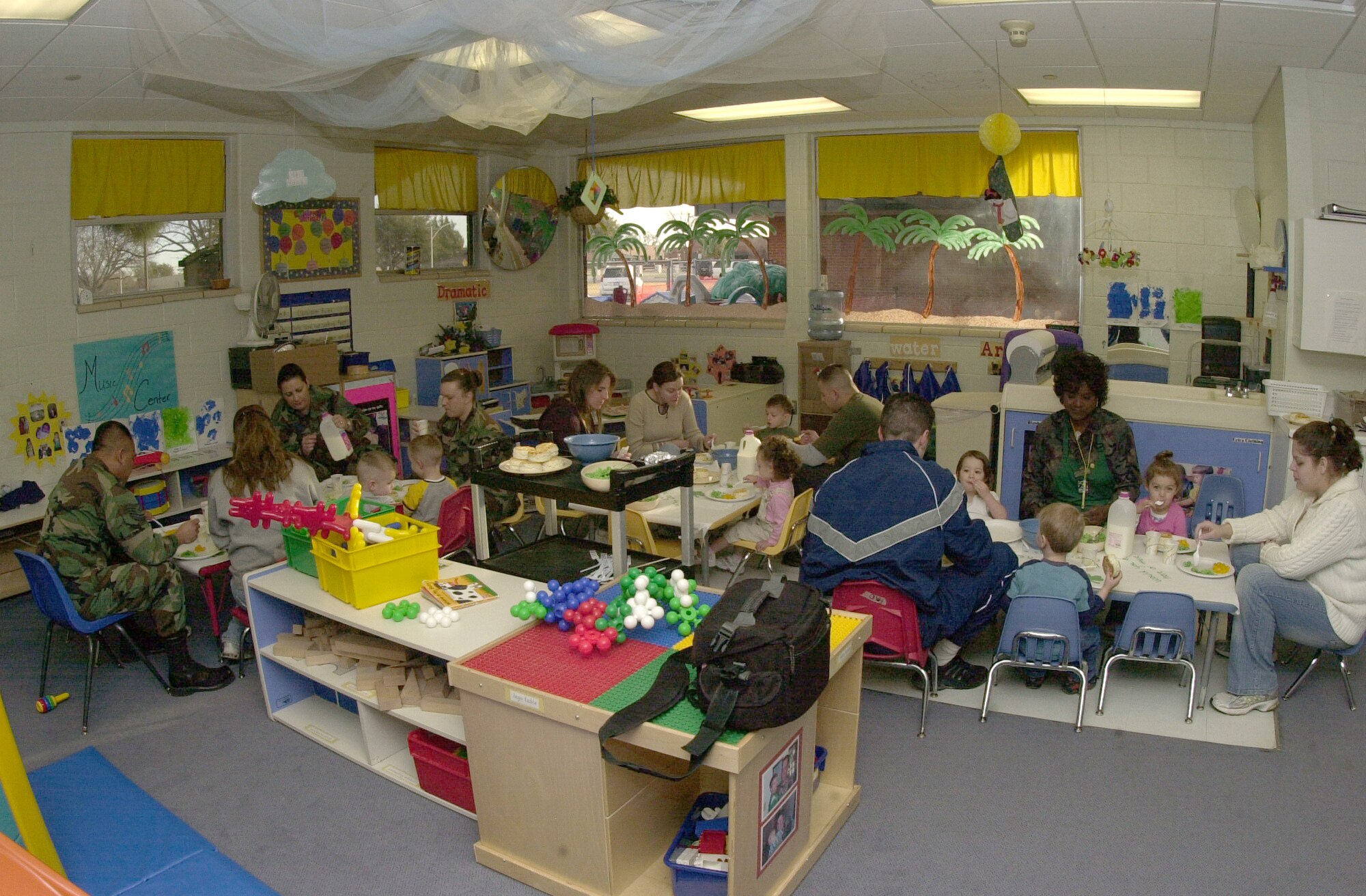 A class room full of students and parents and CDC staff enjoy their breakfast meal of green eggs and ham in Ms. Dorethea Mayberry’s class room for 2-year-olds.