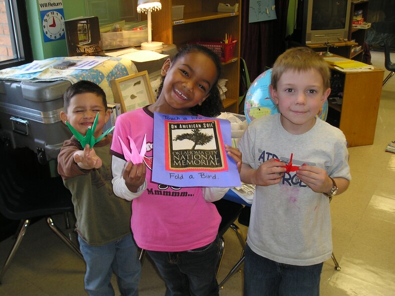 VANCE AIR FORCE BASE, Okla. -- Jonathan Caithaml, Jasmine Butler and Sam Keith
display Origami cranes they folded for the Hope Trunk.  (U.S. Air Force photo/Kim Winfield)