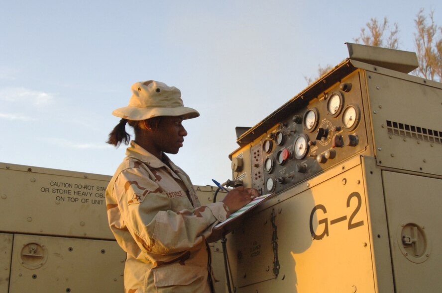 Balad Air Base, Iraq - Airman Yana Overstreet, an Air Ground Equipment (AGE) maintainer, conducts a routine systems check of a generator at Balad Air Base, Iraq. Airman Overstreet is assigned to the 727th Expeditionary Air Control Squadron (EACS) and is deployed from the 728th Air Control Squadron at Eglin Air Force Base, Fla. Also known as Kingpin, the self-sustaining 727th EACS is comprised of nealry 200 Airmen from 27 different Air Force specialties. AGE maintainers are critical to supplying unique power requirements to Kingpin's radar control equipment, ensuring positive control over aircraft operating in Iraq's 277,000 miles of airspace. (U.S. Air Force photo/Major Damien Pickart)               