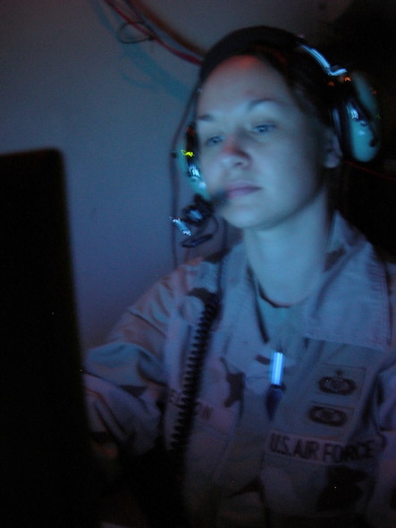 Balad Air Base, Iraq - Staff Sgt. Crystal Nelson, an enlisted weapons director, monitors OIF aircraft operations from inside an Operations Module van at Balad Air Base, Iraq. Sergeant Nelson is assigned to the 727th Expeditionary Air Control Squadron (EACS) and is deployed from the 728th Air Control Squadron at Eglin Air Force Base, Fla. Also known as Kingpin, the 727th EACS is responsible for maintaining positive control over aircraft operating in Iraq's 277,000 miles of airspace. (U.S. Air Force photo/Major Damien Pickart)                     