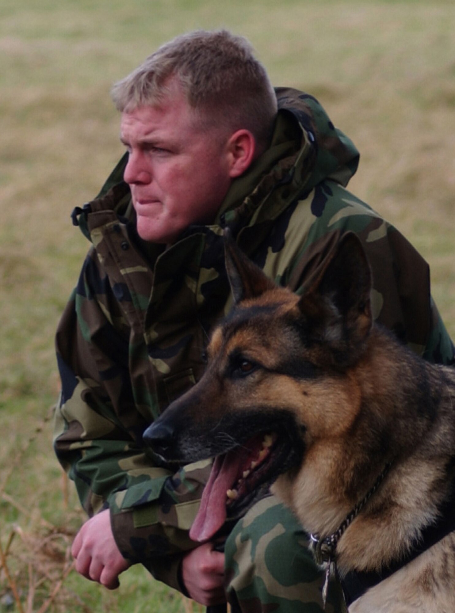 Staff Sgt. Jammie Gannon and his K-9 dog Ronny from RAF Milldenhall Security Forces participate in the combat training event at Stanta training range near Thetford, England March 6, 2007. (U.S. Air Force photo by Airman Brad Smith)                                 