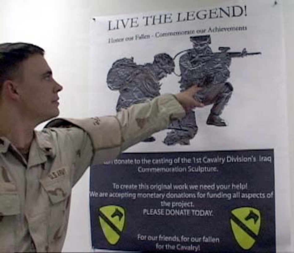 Sgt. Joshua Wood, a squad leader with the 545th Military Police Company, 1st Cavalry Division, points to his own likeness in a poster of the new division memorial. Wood is one of two soldiers who will be immortalized by a bronze sculpture at division headquarters at Fort Hood, Texas. The sculpture is based on an April photo featuring Wood and Sgt. Matthew Tuttle. Photo by Sgt. Christina Rockhill, USA 