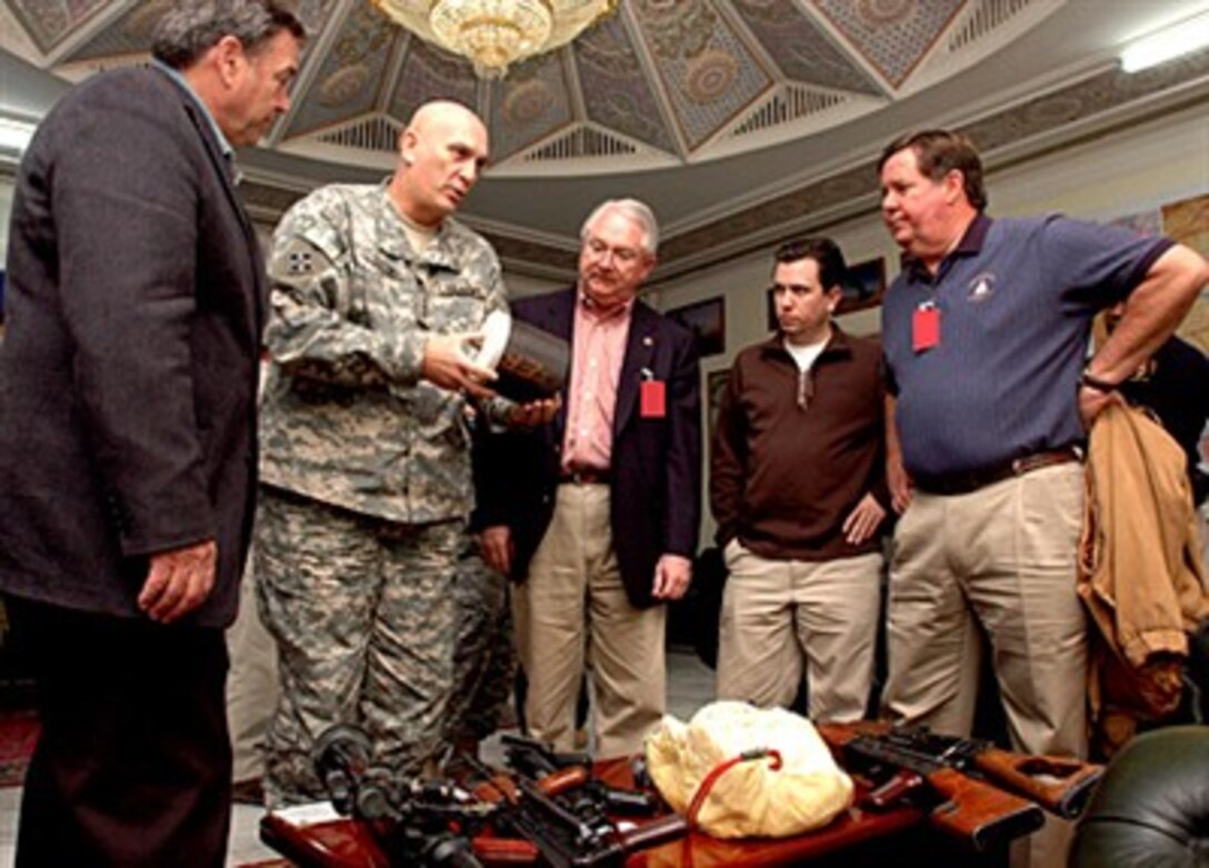 U.S. Army Lt. Gen. Ray Odierno, commander of Multi-National Corps - Iraq, and visiting congressmen inspect a cache of recently seized weapons March 11, 2007, at Al Faw Palace, Iraq. 