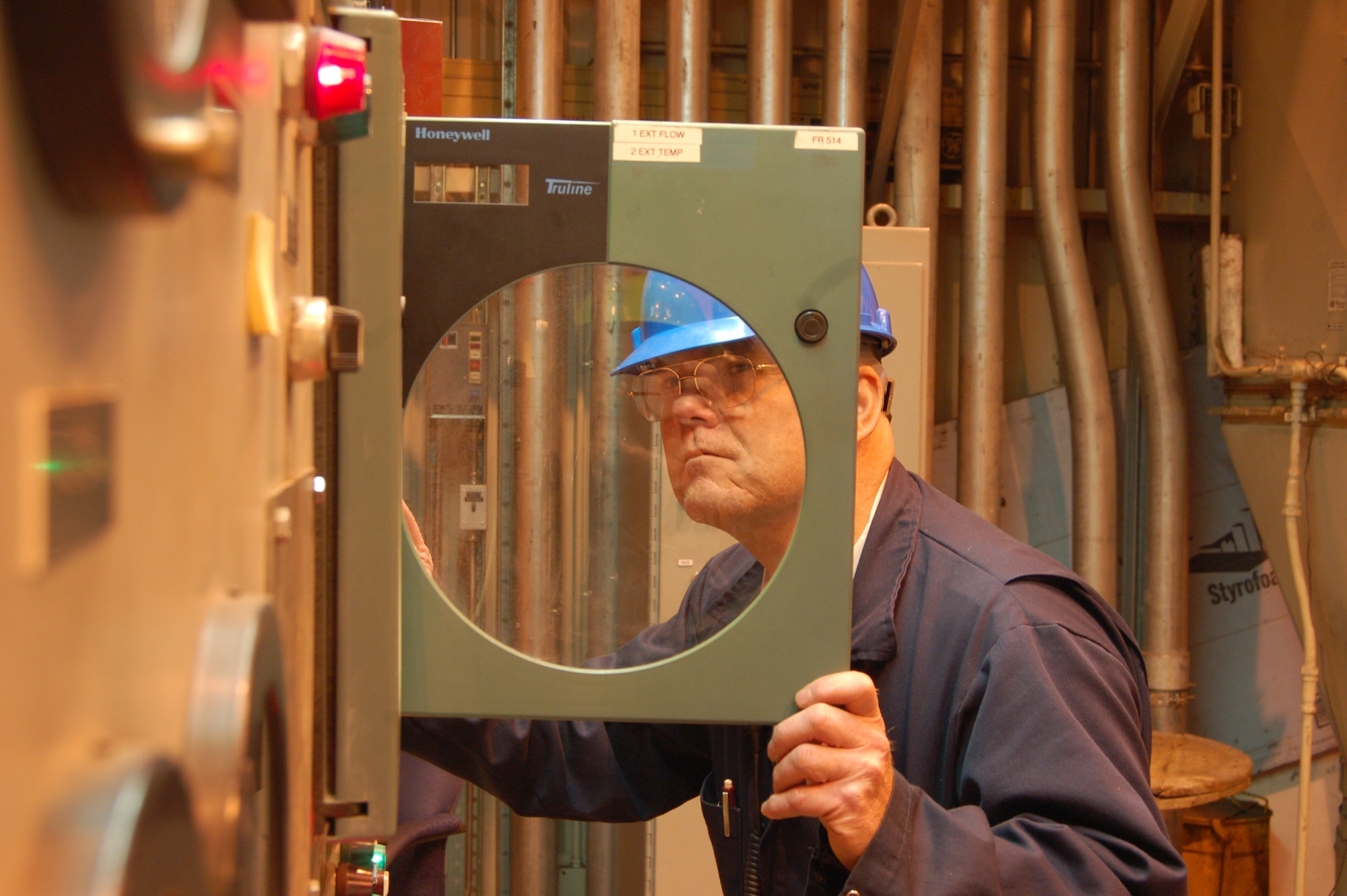 Charles Vargo inspects the No. 5 turbine steamflow and extraction flow gauge at the central heat and power plant at Eielson Air Force Base, Alaska, Feb. 28. The gauges evaluate the amount of steam that flows to and power that flows from the power turbines. The plant generates more than 380,000 pounds of steam per hour, which is used to create heat and electricity for the base. Mr. Vargo is an electrical dispatcher at the power plant. (U.S. Air Force photo/Staff Sgt. Matthew Rosine) 