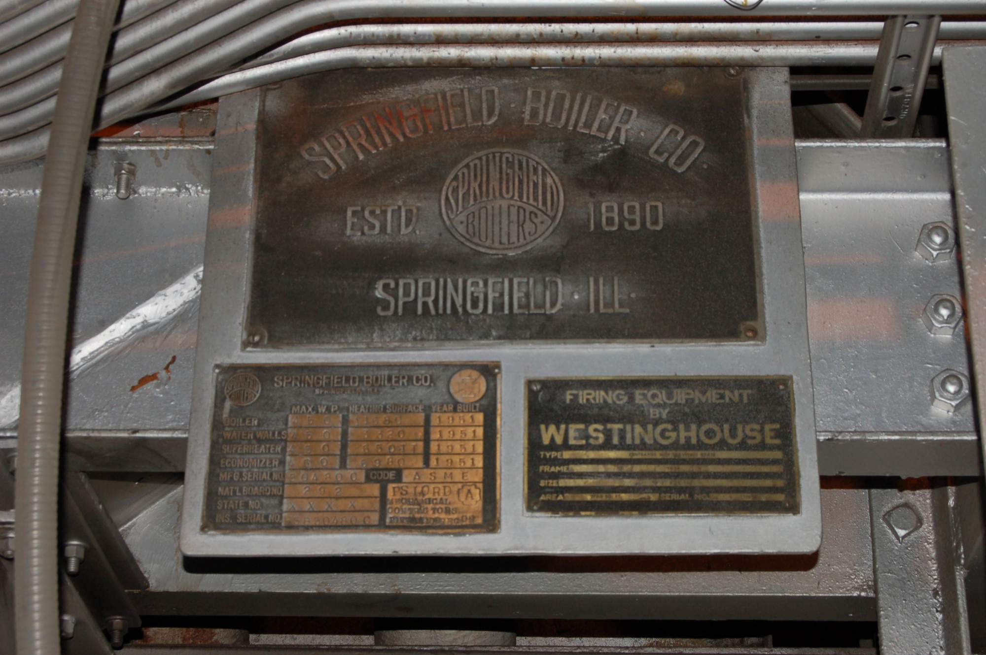 A manufacturer's data plate hangs on one of the boilers at the central heat and power plant at Eielson Air Force Base, Alaska, identifying one of four boilers originally installed in 1951 and still in use. The last two boilers were installed years later, but are scheduled to be either repaired or replaced this summer. These boilers produce more than 380,000 pounds of steam per hour, which is used to create heat and electricity for the base. Only 150 miles away from the Arctic Circle, temperatures at the base can drop to more than 60 degrees below zero during the winter. (U.S. Air Force photo/Staff Sgt. Matthew Rosine) 