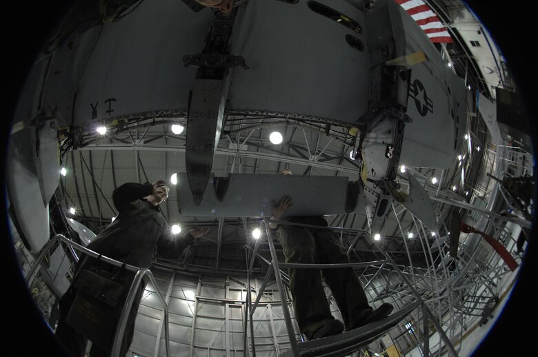 EIELSON AIR FORCE BASE, Alaska -- Airman First Class Guy Mitchell (left), 354th Aircraft Maintenance Squadron, and Senior Airman Timothy Jeter (right), 354th Maintenance Squadron, replace an A-10 Thunderbolt II leading edge panel during phase maintenance on Mar. 13. Phase maintenance is an overhaul of the entire aircraft which ensures it is ready for safe flight.The 354th Maintenance Squadron is in charge of the Phase program and can turn an A-10 around in 10 days.
(U.S. Air Force Photo by Staff Sgt Joshua Strang)