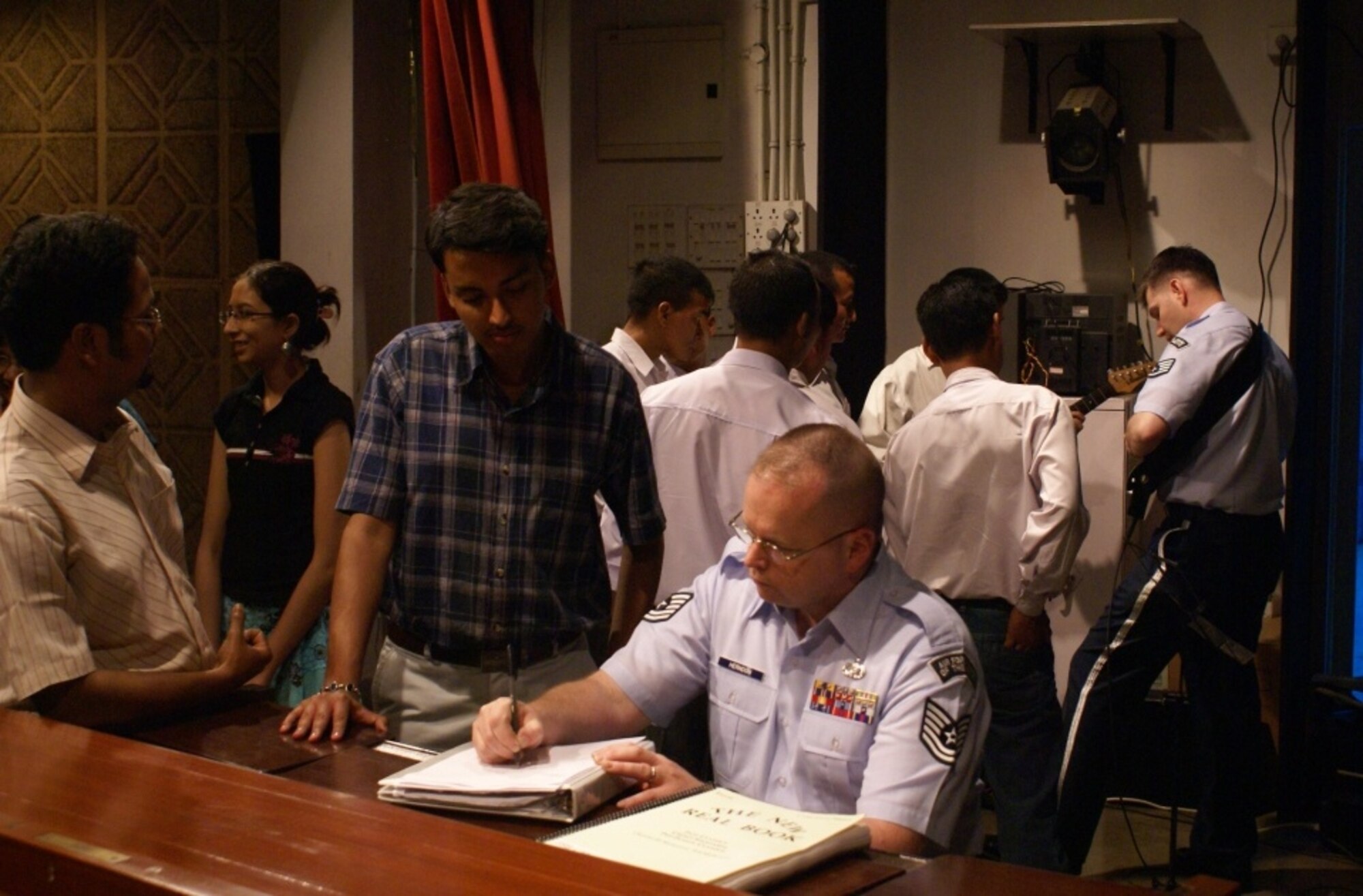CALCUTTA, India -- Tech Sgt Neil Herndon, piano, and Staff Sgt Tim Rogers, guitar, provide music instruction to local Calcutta music students. The Pacific Air Forces rock group, Pacific Trends, was invited by the Chief of Staff of the Indian Air Force to help celebrate the Indian Air Force’s 75th Anniversary. 