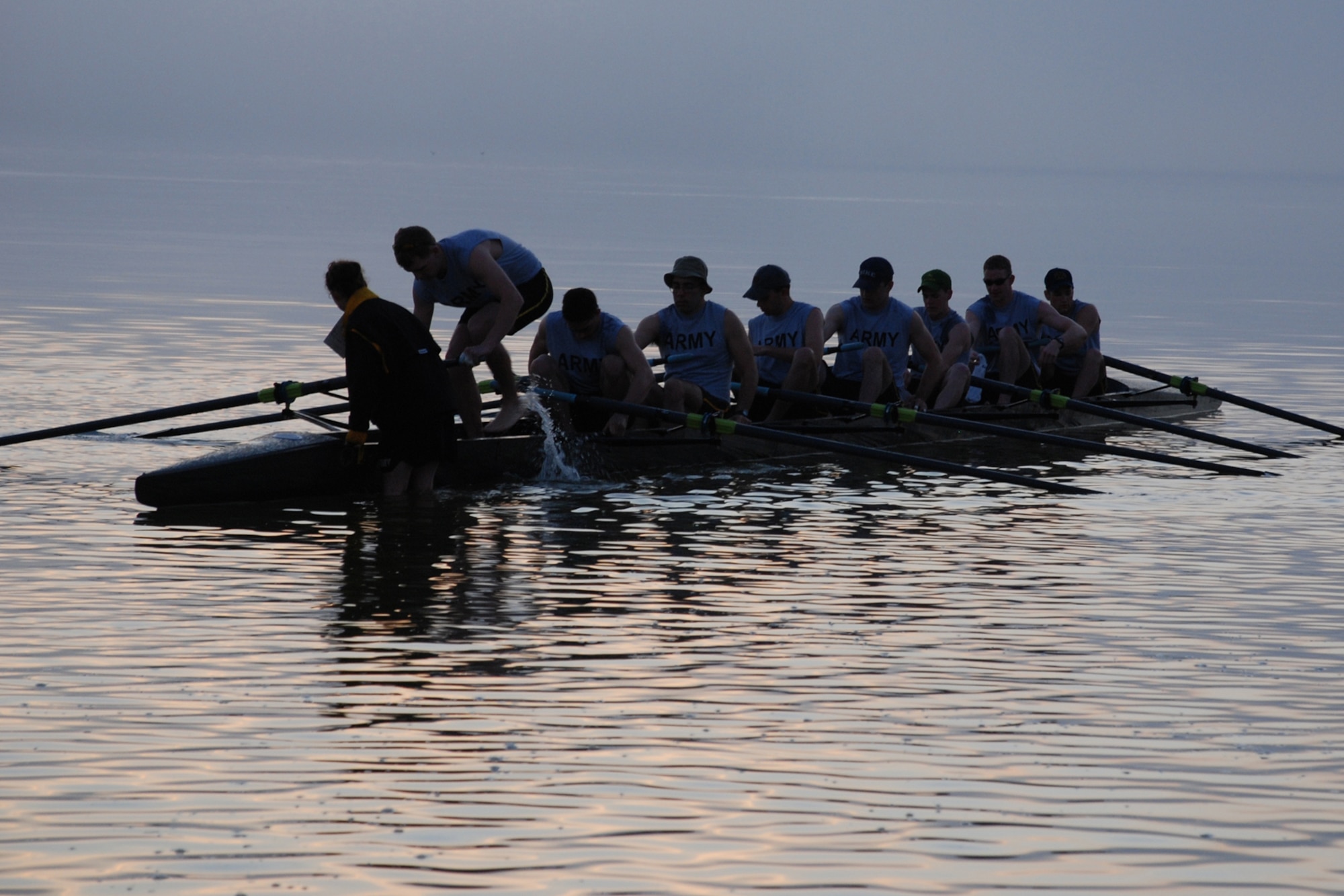 EGLIN AIR FORCE BASE, Fla. -- The fog rolls in over the water as the Eric Munn (senior), U.S. Military Academy Crew Team men's novice squad, climbs in the boat at Postal Point during an early morning workout March 13 in Choctawhatchee Bay. The team is split up into four squads: men's varsity and novice, and women's varsity and novice. The team is here during their spring break to practice in the warmer Florida temperatures. The men's varsity squad was ranked 20th in the nation at the end of last season. (U.S. Air Force photo by Staff Sgt. Mike Meares)