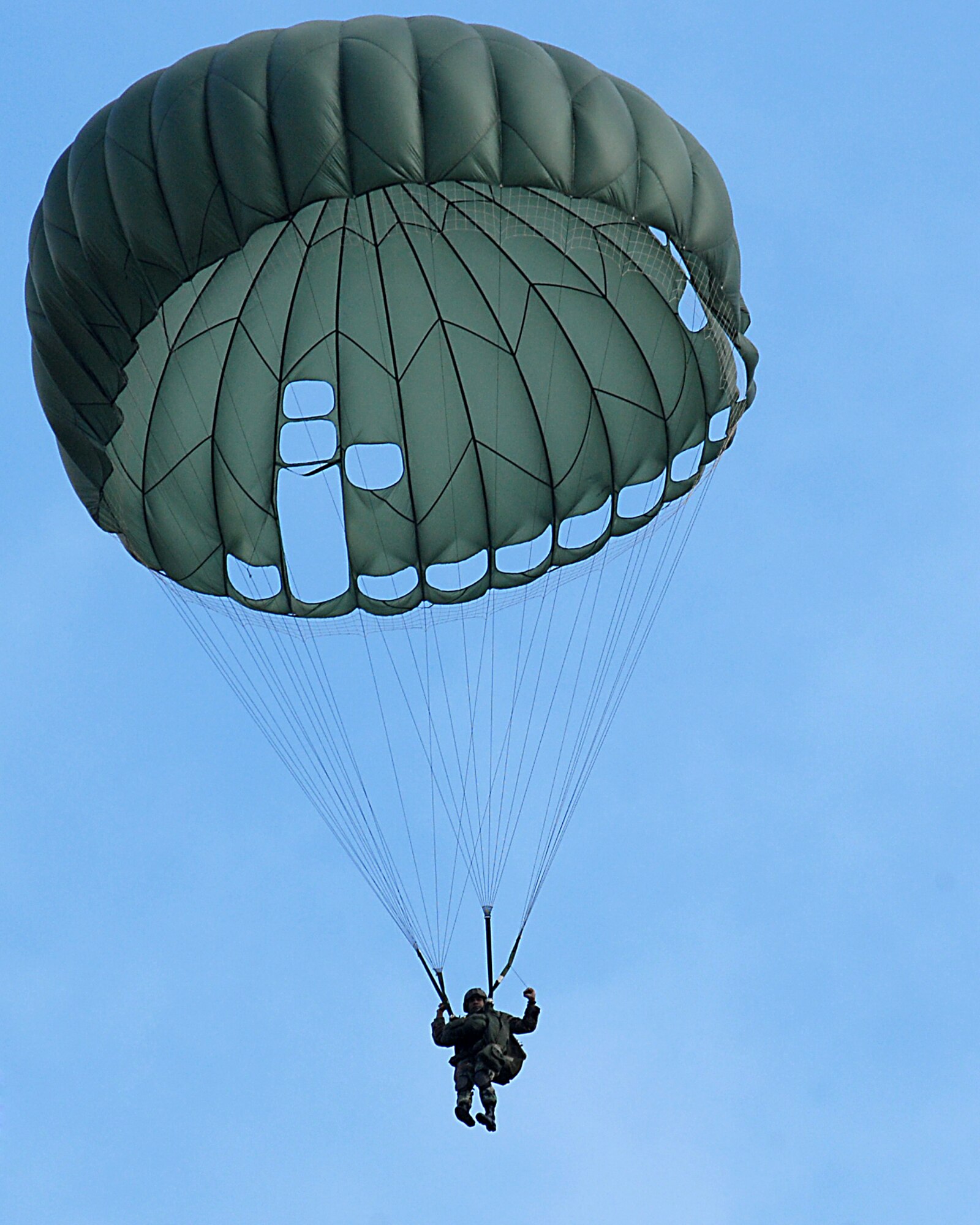 An Airman of the 786th Security Forces from Sembach Annex, Germany parachutes down March 8 during a tactical training exercise over southwestern Germany. (U.S. Air Force photo/Airman Kenny Holston) 