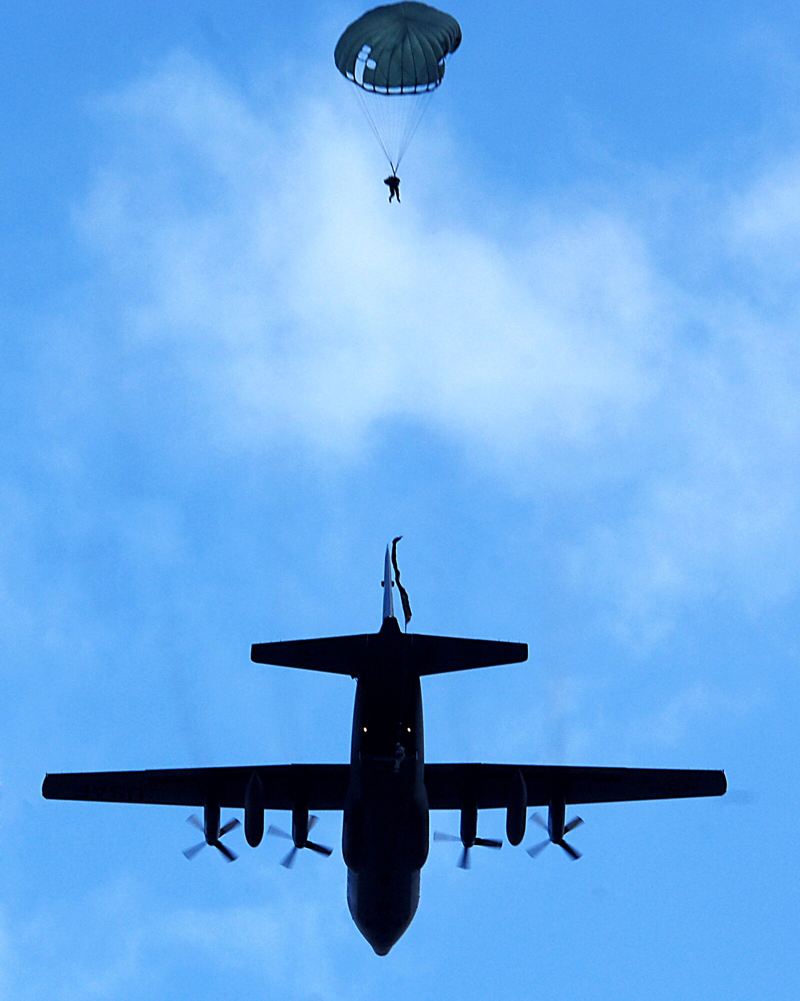 Airmen with the 786th Security Forces Ravens from Sembach Annex, Germany and Soldiers from the 5th Quarter Master Arial Delivery crew execute an airborne jump exercise March 8 over southwestern Germany. (U.S. Air Force photo/Airman Kenny Holston) 