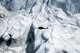 A UH-IN Iroquois helicopter from the AF Reserve's 304th Aerospace Rescue and Recovery Squadron flies near the peak of Mount saint Helens several days after a large eruption. (U.S. Air Force photo/Master Sgt. Robert Leach)