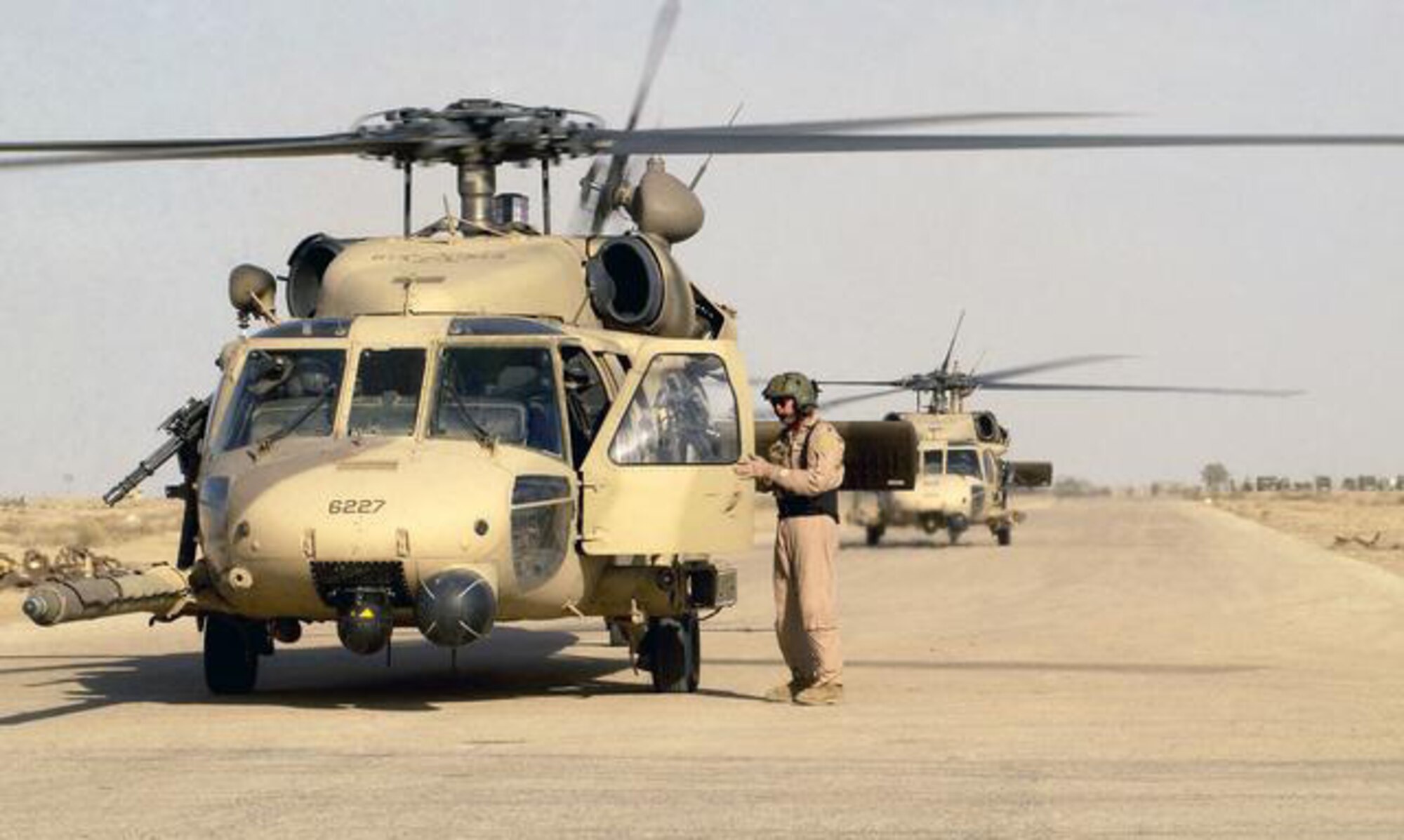 A pair of Air Forec Reserve HH-60G Pave Hawk helicopters from the 301st Rescue Squadron, Patrick AFB, Fla., take part in the initial combat phase of Operation Iraqi Freedom. The reservists operated out of Tallil Air Base, Iraq, immediately after the base was secured by coalition ground forces. (U.S. Air Force photo/Staff Sgt. Shane Cuomo)