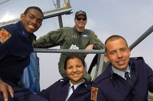 Cadets 1st Lt. Tinsley Paige,  Staff Sgt. Katherine Brazell, and Airman Josh Smith, Air Force Junior Reserve Officer Training Corps members from Rome High School speak with Maj. Terry McClain, an A-10 Thunderbolt pilot and air reserve technician from Barksdale Air Force  Base, La., about the Air Force Reserve during JROTC week at Dobbins Air Reserve Base, Ga.  “It’s all about training the next generation,” said Major McClain.  “We don’t get to serve in the military forever.  We have to prepare our young people to take our place.”  Major McClain is assigned to the 47th Fighter Squadron. (U.S. Air Force courtesy photo)