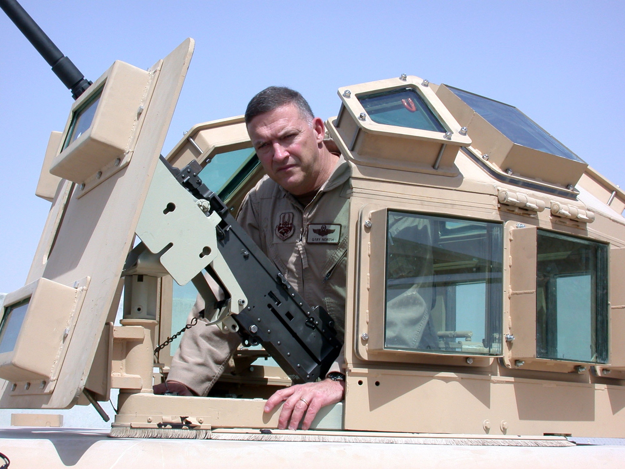 Lt. Gen. Gary North, U.S. Central Command Air Forces commander, gets a first-hand look at an improved protective turret prototype developed by the USCENTAF force protection staff in concert with the Air Force Security Forces Force Protection Battlelab.  The prototype's development and testing, in less than 80 days, stemmed from the death of Airman 1st Class Leebernard Chavis, who was killed by sniper fire in October 2006.  (U.S. Air Force photo)