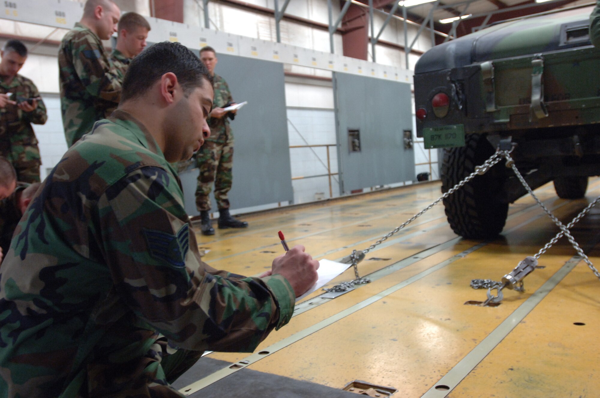 Staff Sgt. Jonathan Touma makes restraint calculations during Basic Loadmaster Course training at Altus Air Force Base. The five and 1/2 week Basic loadmaster Course taught at the 97th Training Squadron takes Airmen through the basics of learning how an aircraft should be balanced, calculating that balance and then properly loading the aircraft according to those calculations. (U. S. Air Force photo by Senior Airman Aldric Borders)