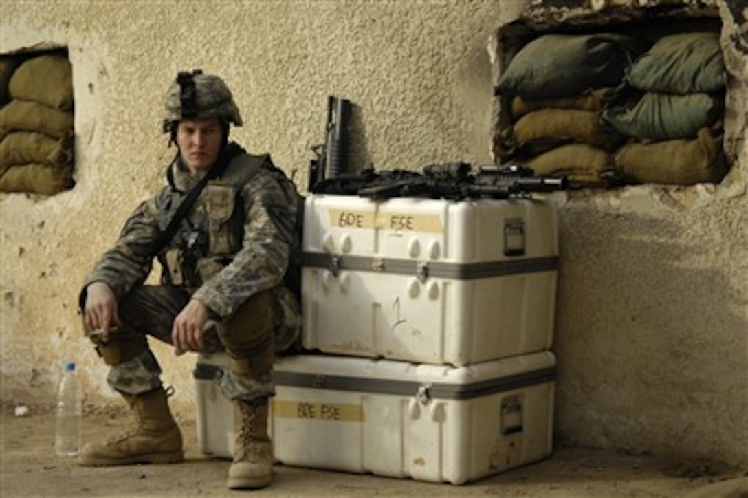 U.S. Army Spc. Cory Barton relaxes before going on a joint foot patrol with Iraqi army soldiers in Buhriz, Iraq, on Feb. 15, 2007.  Barton is attached to Bravo Company, 1st Cavalry Division, 12th Infantry Regiment.  