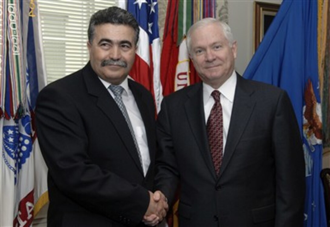 Secretary of Defense Robert M. Gates and Israeli Minister of Defense Amir Peretz pose for photographers prior to their meeting  at the Pentagon March 13, 2007.  The two leaders are meeting to discuss defense issues of mutual interest.