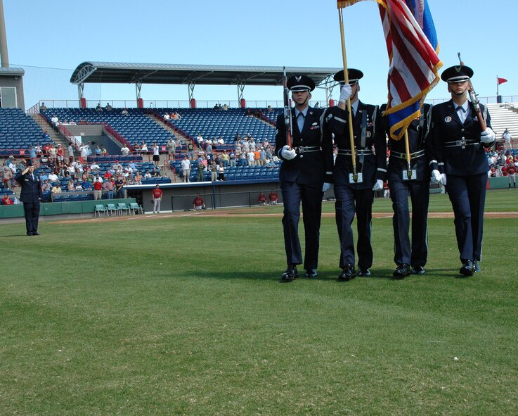 The Honor Guard from Patrick Air Force Base presented the colors during opening ceremonies at a March 8 Washington Nationals Spring Training Game at the Space Coast Stadium in Viera, Fla.  The honor guard is comprised of Active Duty and Reserve Airman from the 45th Space Wing and the 920th Rescue Wing at Patrick AFB, respectively.  Maj. Chad Gibson, 403rd Wing Public Affairs Officer saluted the honor guard after they presented the colors during his rendition of the national anthem.
