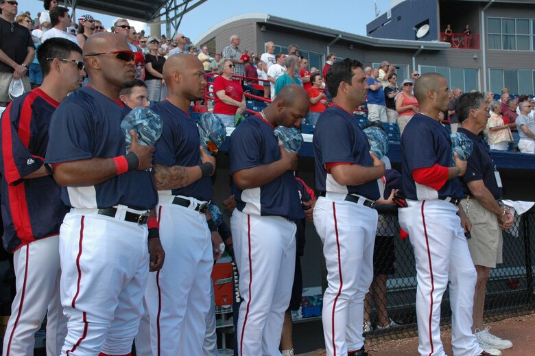 The Washington Nationals Baseball Team bowed their heads and held their ball caps over their hearts while the 920th Rescue Wing conducted opening ceremonies at a March 8 Spring Training Game in Viera, Fla.  The Patrick Air Foce Base Honor Guard, comprised of Air Force Reservists and members of the Active duty Air Force presented the colors while Maj. Chad Gibson, 403rd Wing Public Affairs Officer, gallantly sang the National Anthem.