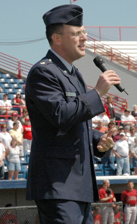 The Washington Nationals Baseball Team took off their ball caps and held them over their hearts while Maj. Chad Gibson, 403rd Wing Public Affairs Officer, gallantly sang the National Anthem during opening ceremonies at a March 8 Spring Training game at the Space Coast Stadium in Viera, Fla.  