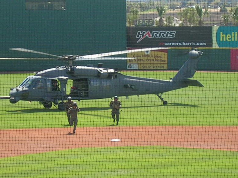Baseball fans cheered when a 920th Rescue Wing helicopter swept over Space Coast Stadium in Viera, Fla., then landed near first base.  The Nationals invited the Rescue Wing to participate in opening day ceremonies during a March 8 Spring Training Game dedicated to the military.  Wearing a flight suit and escorted by two of the Wing's pararescuemen, Wing Commander, Col. Steve Kirkpatrick threw out the first pitch.  The Nationals beat the Astros.
