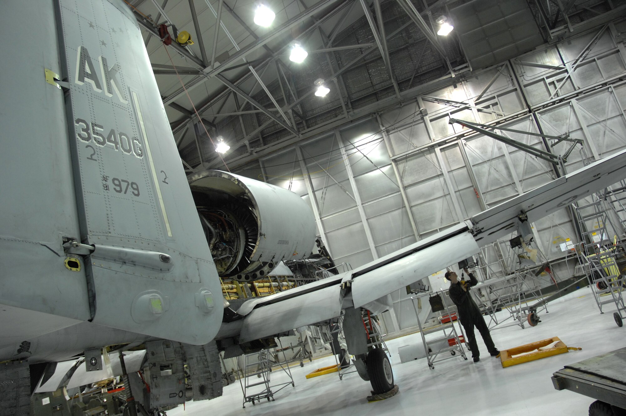 Airman 1st Class Mitchell Guy removes a leading edge panel on an A-10 Thunderbolt II March 13 during phase maintenance at Eielson Air Force Base, Alaska.  During phase maintenance, Airmen overhaul the entire aircraft to ensure it is ready for safe flight.  Airman Guy and the other maintainers in the 345th Aircraft Maintenance Squadron can turn an A-10 around in 10 days.  (U.S. Air Force photo/Staff Sgt Joshua Strang)