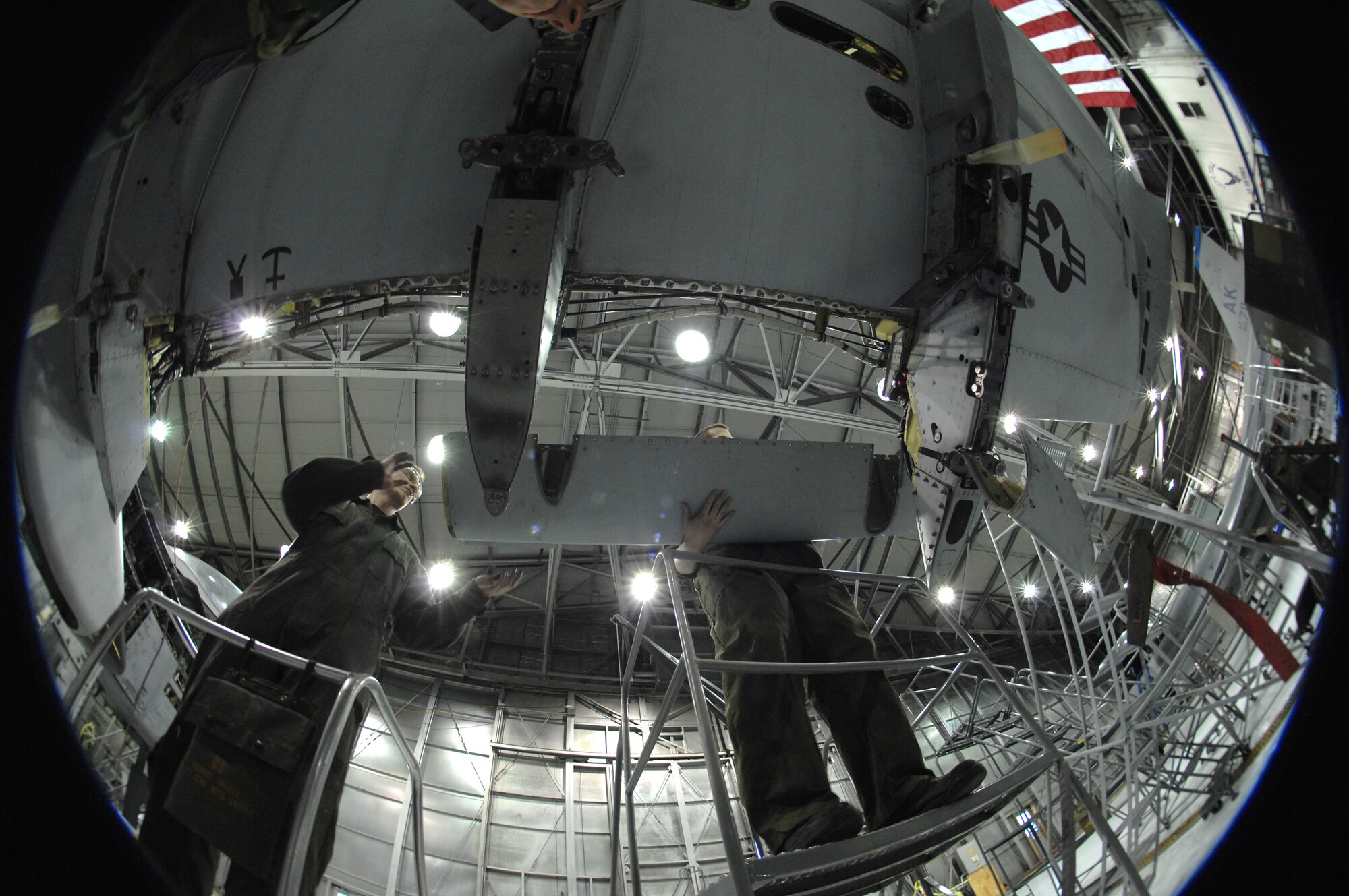 Airman 1st Class Mitchell Guy (left) and Senior Airman Timothy Jeter replace a leading edge panel on an A-10 Thunderbolt II March 13 during phase maintenance at Eielson Air Force Base, Alaska.  During phase maintenance, Airmen overhaul the entire aircraft to ensure it is ready for safe flight.  The Airmen and the other maintainers in the 345th Aircraft Maintenance Squadron can turn an A-10 around in 10 days.  (U.S. Air Force photo/Staff Sgt Joshua Strang)
