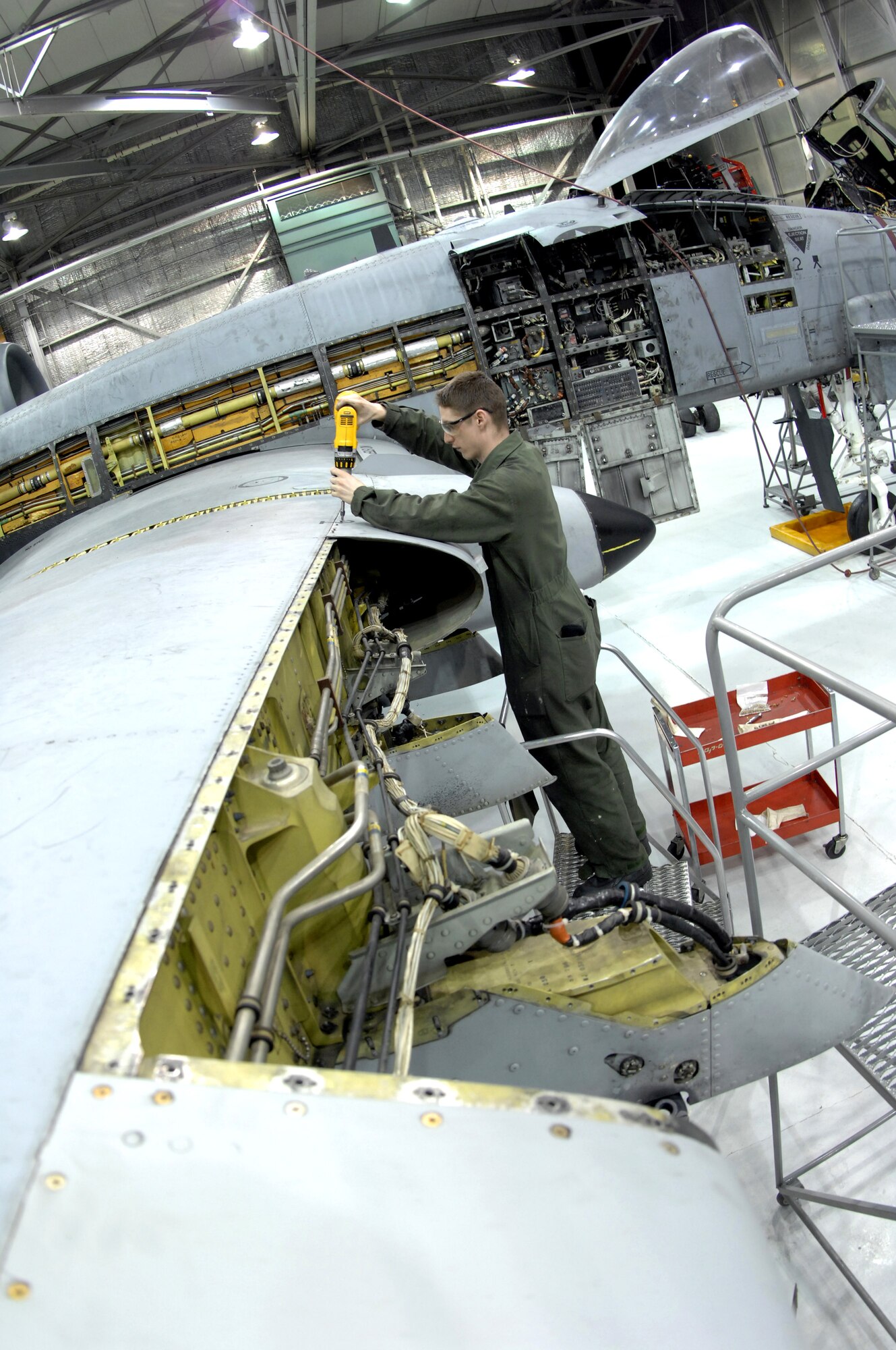 Airman 1st Class Mitchell Guy removes a leading edge panel on an A-10 Thunderbolt II March 13 during phase maintenance at Eielson Air Force Base, Alaska.  During phase maintenance, Airmen overhaul the entire aircraft to ensure it is ready for safe flight.  Airman Guy and the other maintainers in the 345th Aircraft Maintenance Squadron can turn an A-10 around in 10 days.  (U.S. Air Force photo/Staff Sgt Joshua Strang)